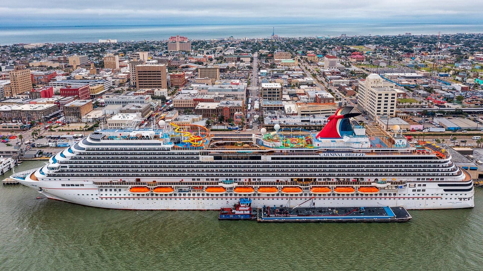 A Carnival ship docked beside the city of Galveston, Texas