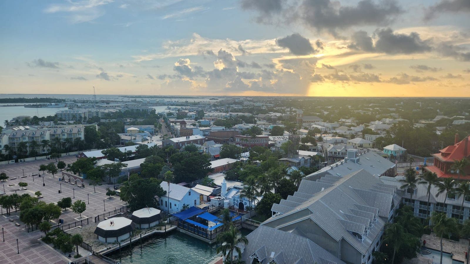 Aerial sunrise view over Key West's Old Town, harbor, and the Key West Aquarium